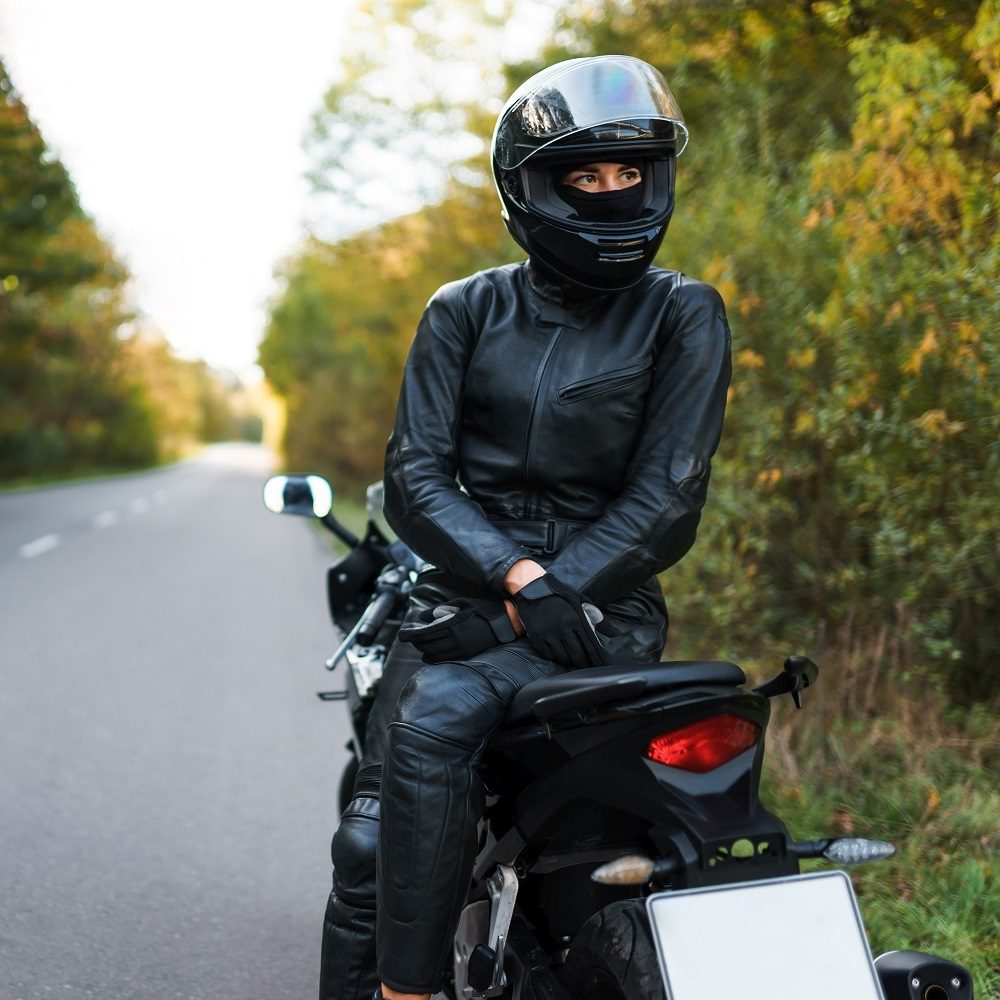 Biker woman sits on a motorcycle